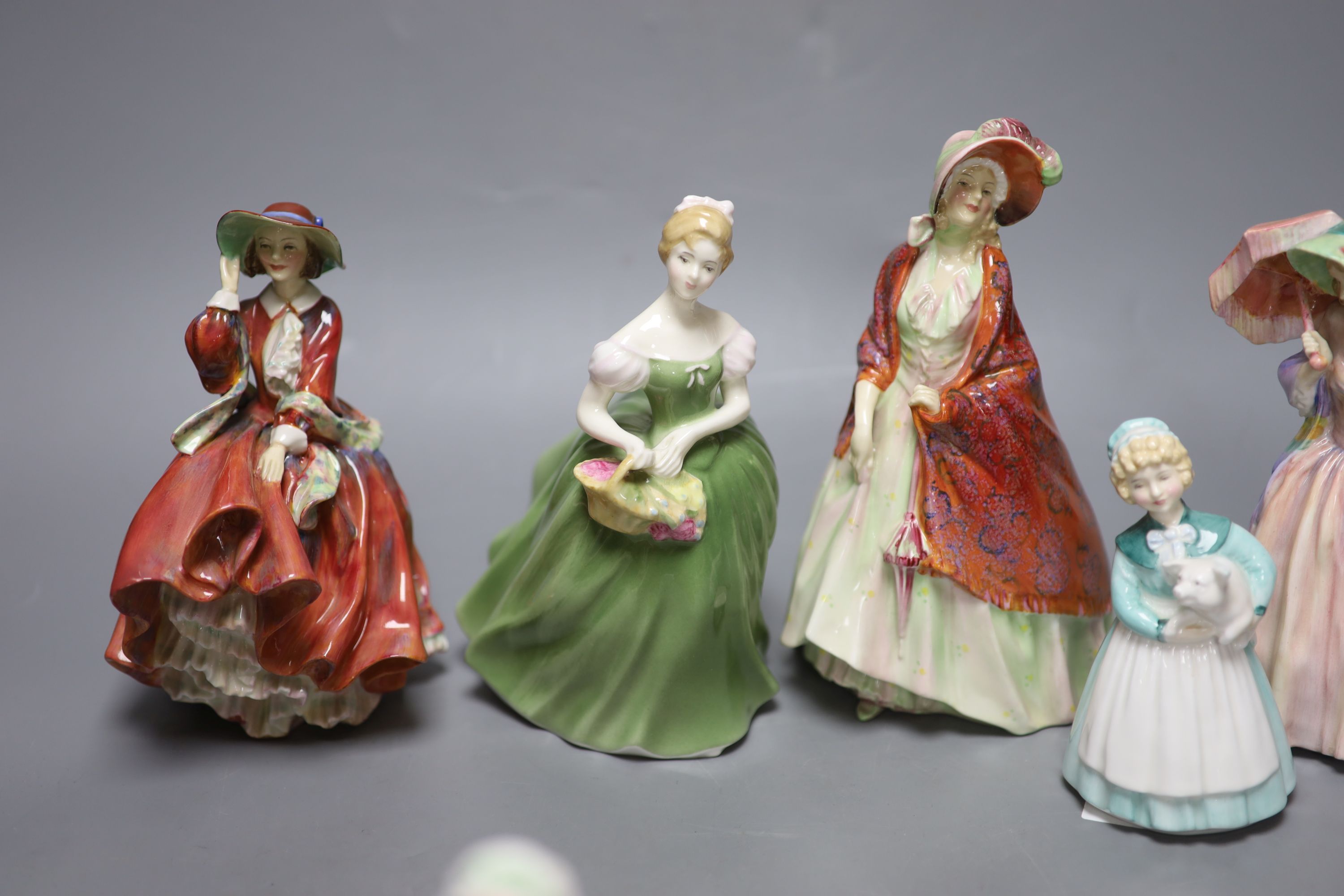 A collection of six Royal Doulton figures; The Paisley Shawl HN1392, Top o the hill HN1834, Clarissa HN2345, Stayed at home HN2207, Ja